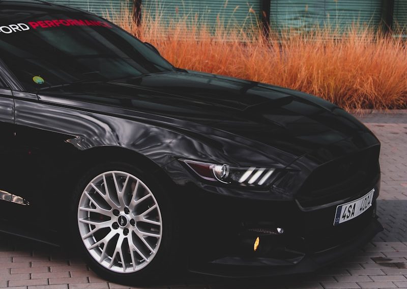 black car on brown pavement